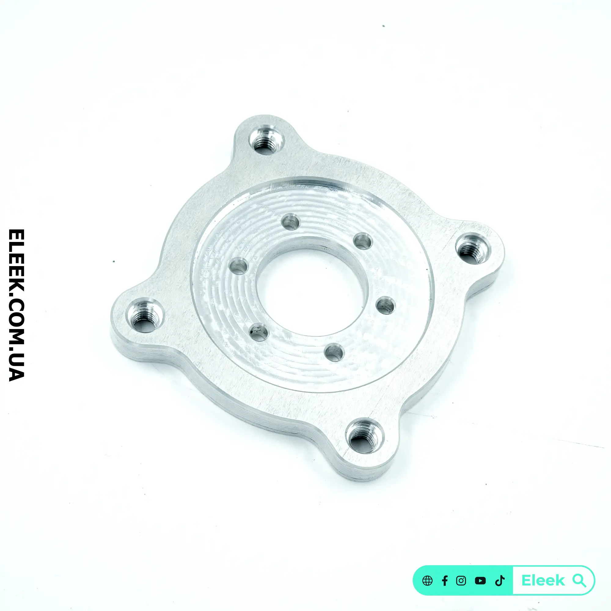 Front view of ELEEK VM-01 CNC machined adapter highlighting 4-bolt motorcycle pattern
