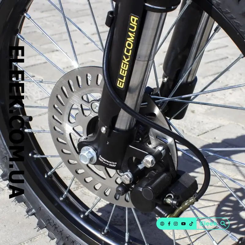 ELEEK brake pads installed on the front disc brake of an electric bike