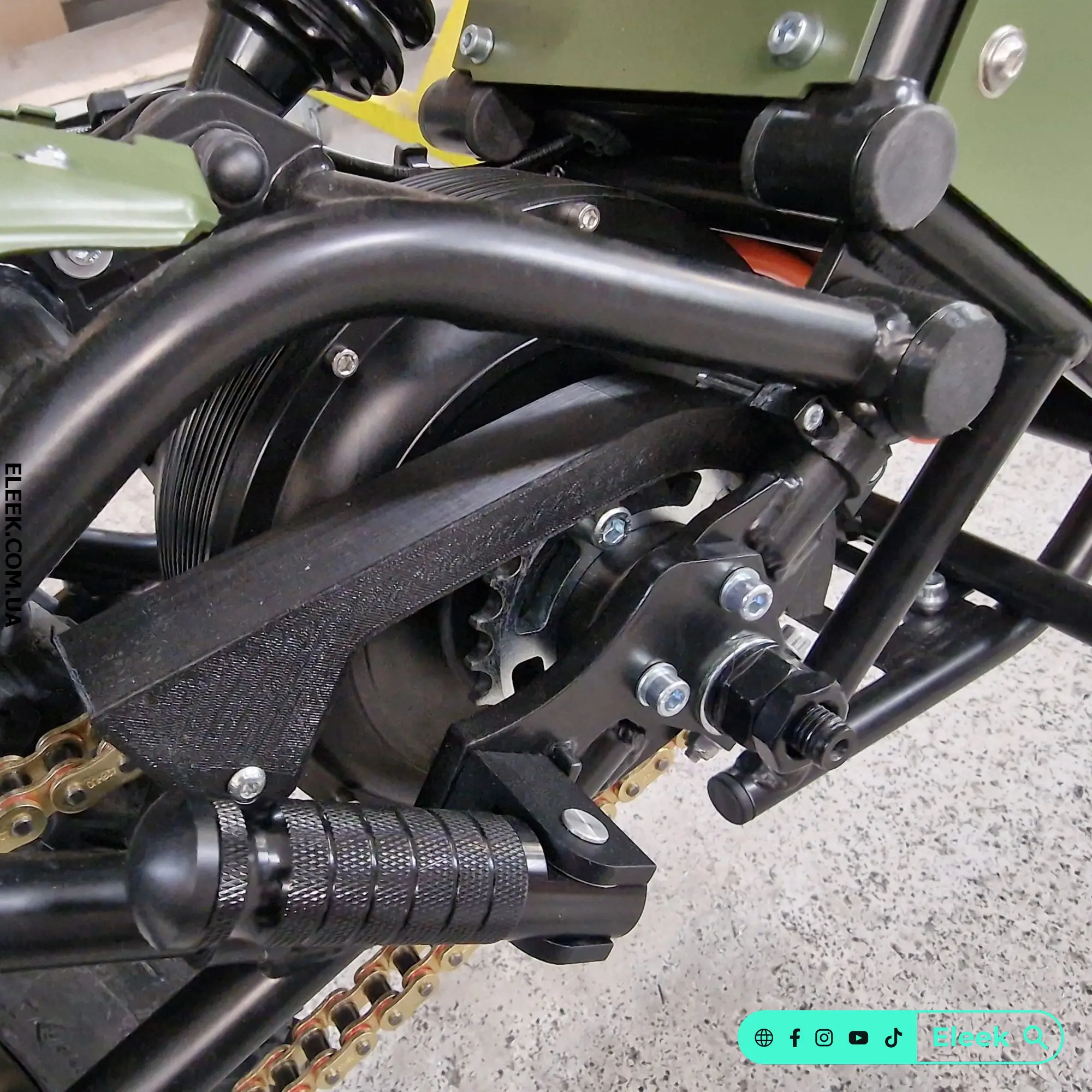 Installed ELEEK SG-P1 sprocket guard on the swingarm of the Positive electric bike